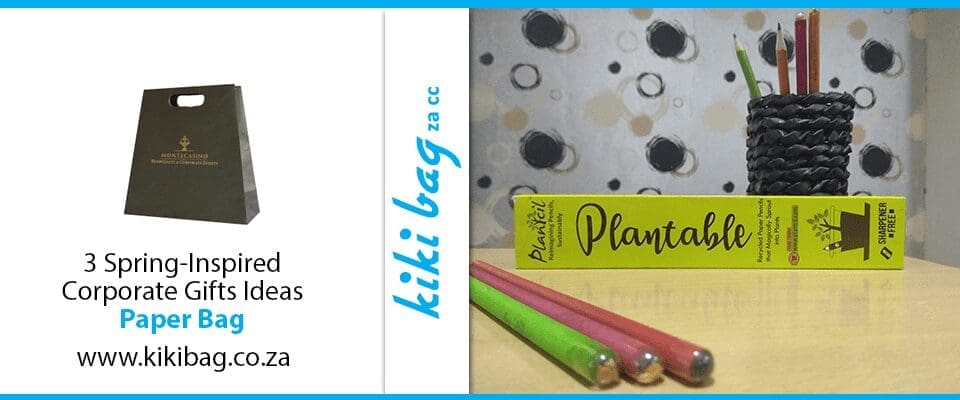 3 plantable pencils next to their box on a countertop in front of a polka dot backdrop