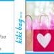 Several pink giftbags covered in hearts await distribution to clients